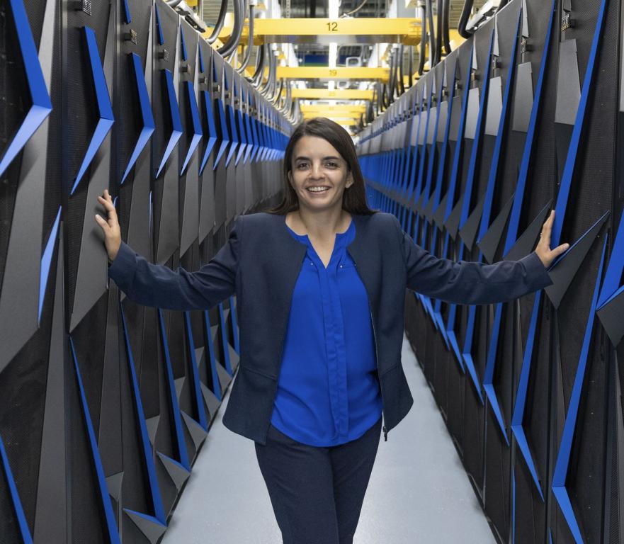 Verónica Melesse Vergara, head of the Operations Section in the National Center for Computational Sciences at ORNL poses with the Summit Supercomputer