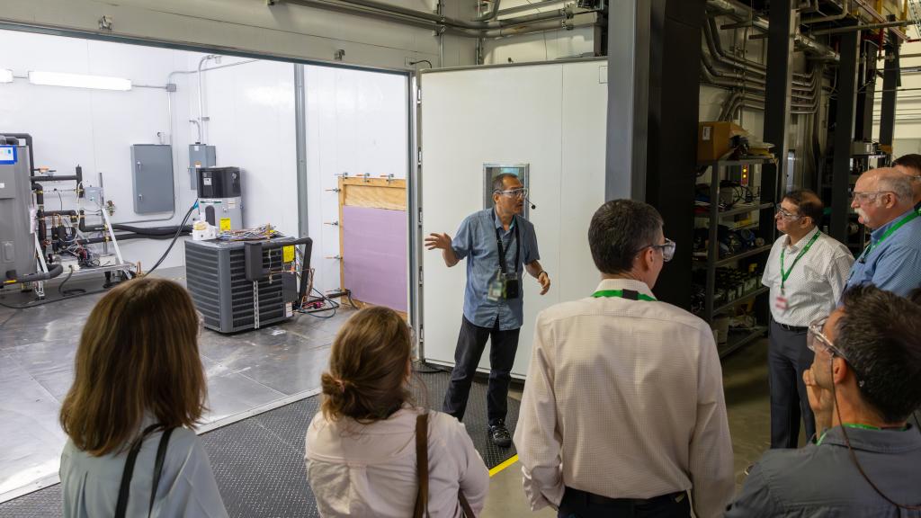 Visitors take a look inside of the Building Technologies Research and Integration Center’s building equipment environmental testing chambers.