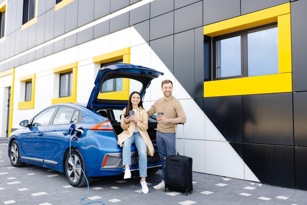 Two people standing with electric vehicle. Image from Envato