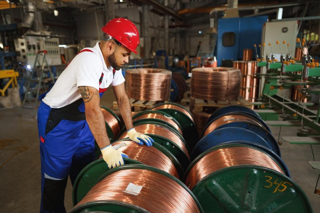 Portrait of African American male handyman working in an industrial factory, close up. Image from Envato.