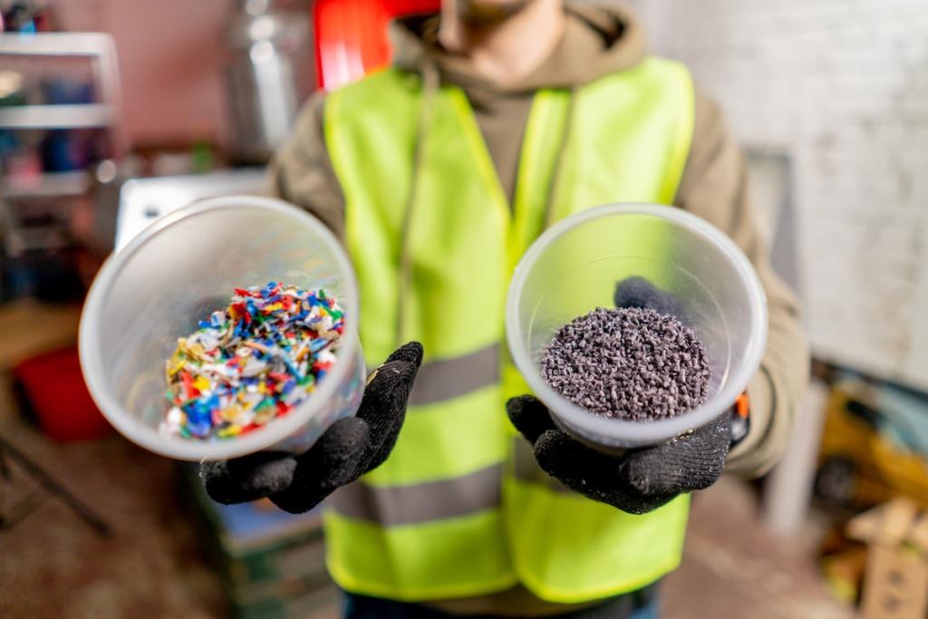 Close-up shot of shredded plastic bottle caps for further recycling at a waste recycling plant. Image from Envato