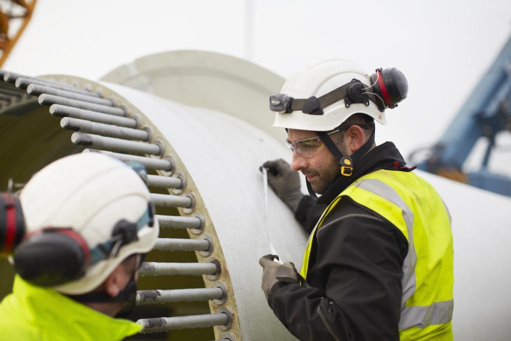 Engineers working on wind turbine. Image from Envato