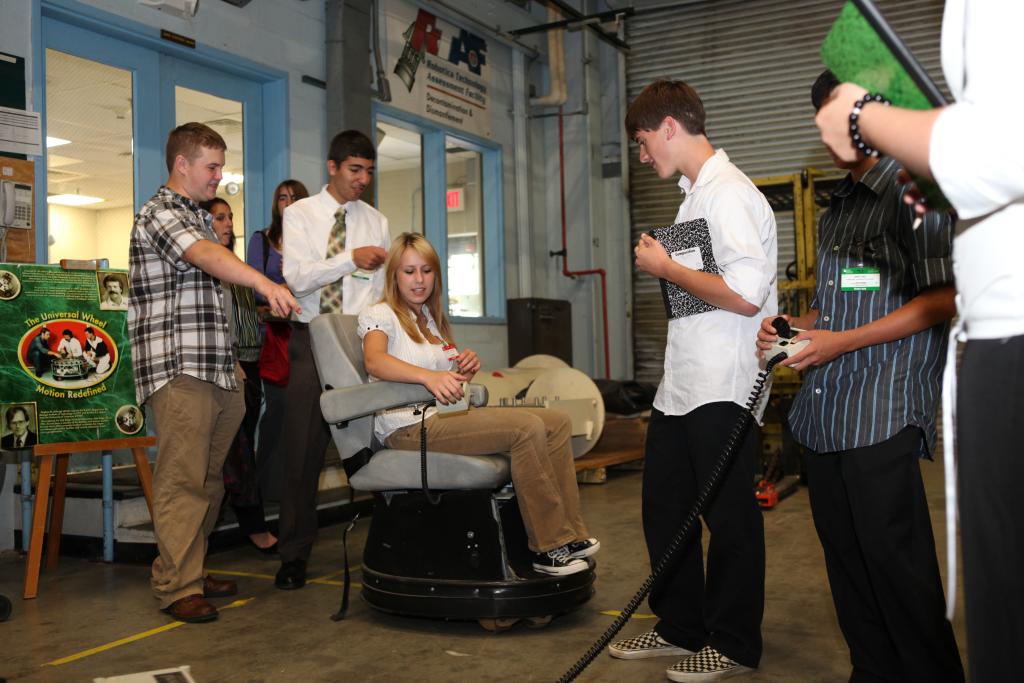 Tennessee Governor’s Academy students try out the Killough wheelchair, which could travel in any direction, during a 2009 tour of ORNL’s Robotics Tech Assessment Facility. Credit: Jason Richards/ORNL, U.S. Dept. of Energy