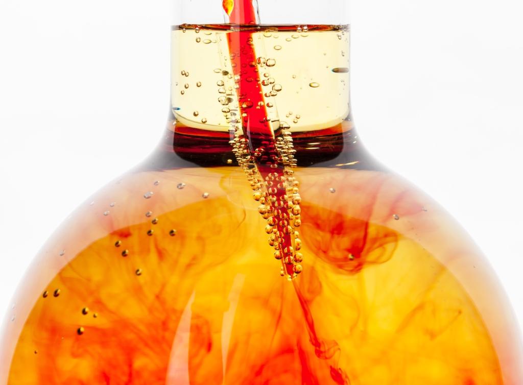 Laboratory flask glassware with reflections on table close up. Image from Envato