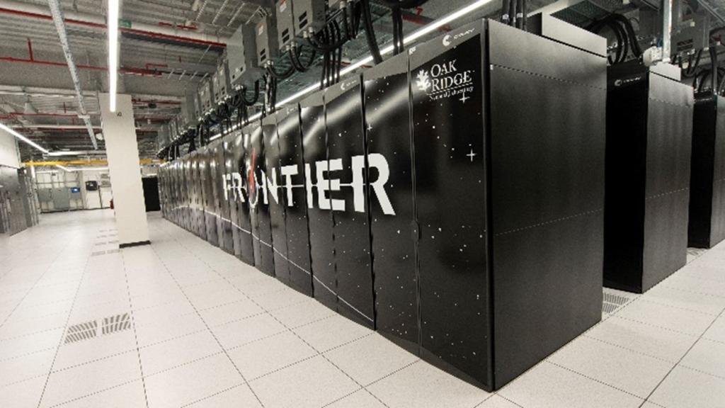Image of the Frontier supercomputer in black with Frontier spelled out across the cabinets in front.