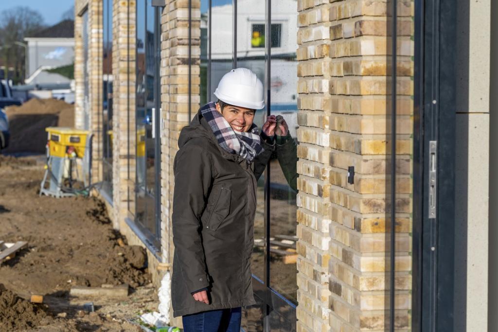 Female construction manager walking around site. Image from Envato