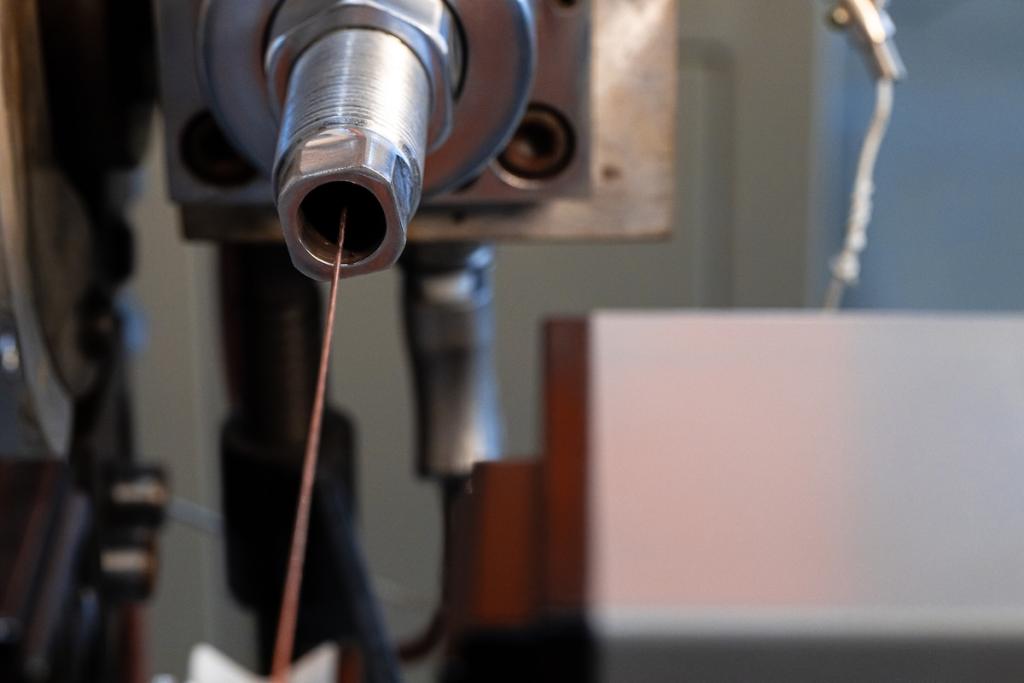 Production of cable wire at cable factory close up. Image from Envato