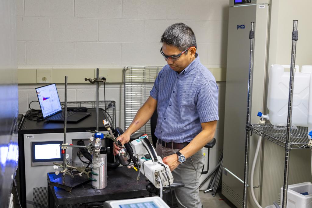a researcher working in a high tech lab