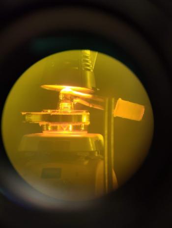 Vial of thorium in yellow light