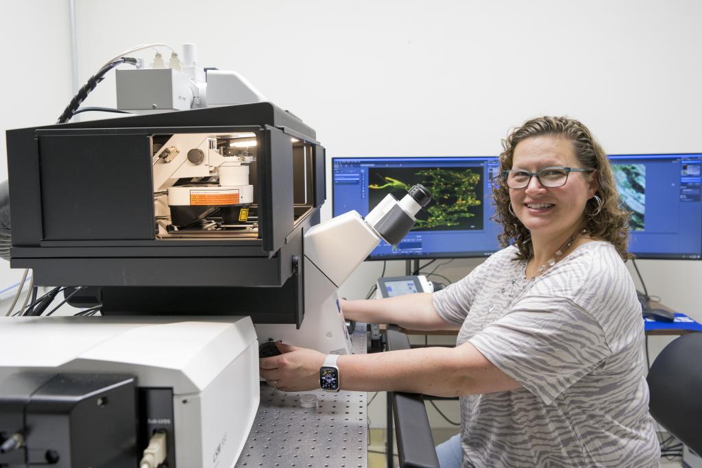 researcher with mass spectrometer