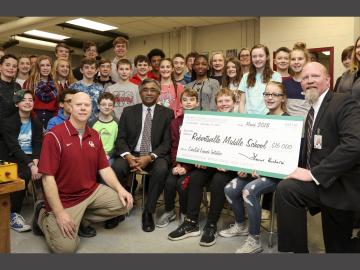 ORNL Director Thomas Zacharia (center, seated) visited Robertsville Middle School to present a check in support of the school’s CubeSat efforts. ORNL Director Thomas Zacharia (center, seated) visited Robertsville Middle School to present a check in support of the school’s CubeSat efforts.
