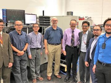 Researchers demonstrated 120 kilowatt wireless power transfer at the National Transportation Research Center, a DOE Office of Science User facility at Oak Ridge National Laboratory. From L-R: ORNL’s Saeed Anwar, Burak Ozpineci, Gui-Jia Su, and David Smith