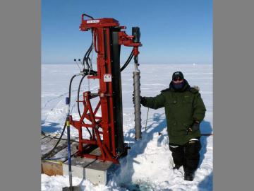 As part of the Next-Generation Ecosystem Experiments Arctic project, scientists use a hydraulic rig to extract soil samples from the frozen soil in Utqiaġvik, Alaska.