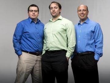 ORNL research scientists Steven Young (left) and Travis Johnston (middle) with ORNL data scientist Robert Patton (right). A team led by Patton is in the running for the 2018 ACM Gordon Bell Prize after it used the MENNDL code and the Summit supercomputer to create an artificial neural network that analyzed microscopy data as well as a human expert. Image Credit: Carlos Jones, ORNL