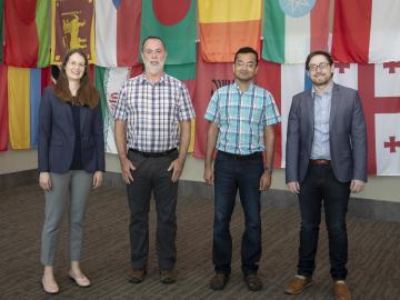 ORNL staff members (from left) Ashley Shields, Michael Galloway, Ketan Maheshwari and Andrew Miskowiec are collaborating on a project focused on predicting and analyzing crystal structures of new uranium oxide phases. Credit: Jason Richards/ORNL