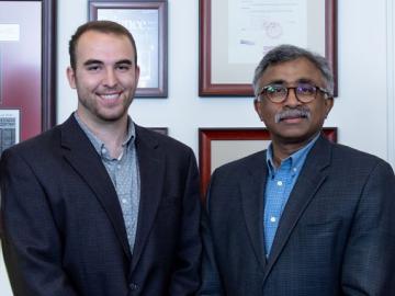 Sweetwater High School senior Will Brackett (left) is congratulated by ORNL Director Thomas Zacharia on receiving the 2019 UT-Battelle Scholarship.