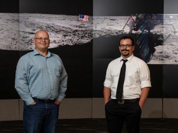 Kevin (left) and Ryan (right) Gaddis are grandsons of Glen Ellis, who worked as a draftsman at Oak Ridge National Laboratory in the 1960s and drew the plans for NASA’s contingency soil sampler, or “moon scoop,” used to collect lunar soil and rock on the Apollo missions. The brothers both work at ORNL. Credit: Carlos Jones/Oak Ridge National Laboratory, U.S. Dept. of Energy.