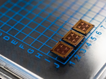 ORNL-developed cryogenic memory cell circuit designs fabricated onto these small chips by SeeQC, a superconducting technology company, successfully demonstrated read, write and reset memory functions. Credit: Carlos Jones/Oak Ridge National Laboratory, U.S. Dept. of Energy