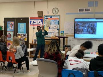 Singanallur “Venkat” Venkatakrishnan shows students at Northwest Middle School how to make a “hoop glider” as part of ORNL’s Engineers Week activities. Credit: Abby Bower/Oak Ridge National Laboratory, U.S. Dept. of Energy.