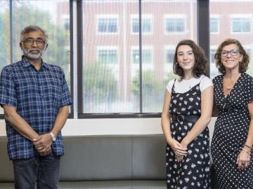 ORNL Director Thomas Zacharia congratulates UT-Battelle Scholarship winner Christiane Alvarez and her mother, Rosemary Walker of Creative Services. Credit: Carlos Jones/Oak Ridge National Laboratory, U.S. Dept. of Energy