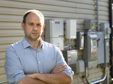 Joe Hagerman is expanding connected neighborhood research at ORNL and envisions buildings of the future as resources capable of managing the flow and exchange of energy based on economic and market signals – a concept known as transactive energy. Credit: Carlos Jones/Oak Ridge National Laboratory, U.S. Department of Energy