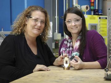 ORNL’s Bianca Haberl and Amy Elliott hold 3D-printed collimators — an invention that has been licensed to ExOne, a leading binder jet 3D printer company. Credit: Genevieve Martin/Oak Ridge National Laboratory, U.S. Dept. of Energy