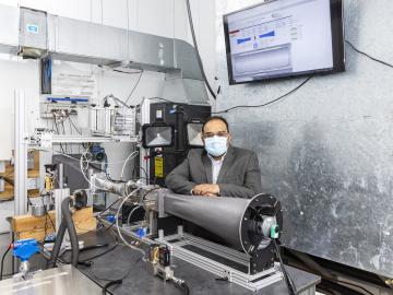 Kashif Nawaz, researcher and group leader for multifunctional equipment integration in buildings technologies, is developing a platform for the direct air capture of carbon dioxide that can be retrofitted to existing rooftop heating, ventilation and air conditioning units.  Credit: ORNL/U.S. Dept. of Energy