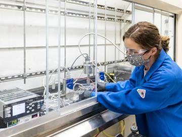 Brenda Smith, shown here working with a gas viscometer in her research lab, is one of several people concurrently researching the thermophysical properties of feedstock gas. Their research will support computational researchers who are designing processes to separate isotopes. Credit: Carlos Jones/ORNL, US Dept. of Energy