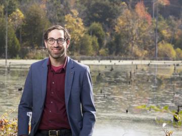 Benjamin Sulman, a scientist in ORNL’s Environmental Sciences Division, creates Earth system models that simulate how plants, microbes and soils interact and influence the cycling of carbon, water and nutrients in their environment. His work aims to helps researchers across disciplines better understand complex, rapidly changing ecosystems, including coastal wetlands and Arctic permafrost soils. Credit: Carlos Jones/ORNL, U.S. Dept. of Energy