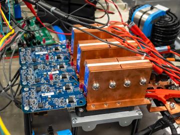 ORNL has licensed its high-powered wireless vehicle charging technology to HEVO, including the Oak Ridge Converter, which reduces the size and increases the efficiency of grid-to-vehicle power transfer infrastructure. Credit: Carlos Jones/ORNL, U.S. Dept. of Energy.