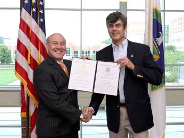 Former ORNL Director Thom Mason presents Tom Kollie with a National Intelligence Meritorious Unit Citation on behalf of James Clapper, former director of national intelligence, and the national intelligence community in June 2017. Credit: Jason Richards/ORNL, U.S. Dept. of Energy