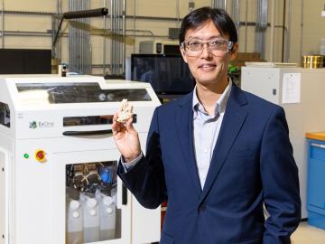 Oak Ridge National Laboratory scientist Tomonori Saito shows a 3D-printed sandcastle at the DOE Manufacturing Demonstration Facility at ORNL. Credit: Carlos Jones/ORNL, U.S. Dept. of Energy