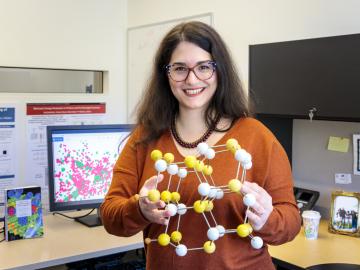ORNL’s Eva Zarkadoula seeks piezoelectric materials for sensors that can withstand irradiation, which causes cascading collisions that displace atoms and produces defects. Credit: Carlos Jones/ORNL, U.S. Dept. of Energy