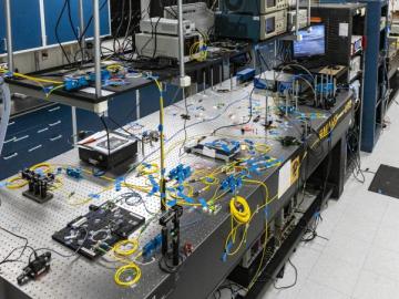 QLAN submit - A team from the U.S. Department of Energy’s Oak Ridge National Laboratory, Stanford University and Purdue University developed and demonstrated a novel, fully functional quantum local area network, or QLAN, to enable real-time adjustments to information shared with geographically isolated systems at ORNL using entangled photons passing through optical fiber. Credit: Carlos Jones/ORNL, U.S. Dept. of Energy