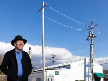 Bruce Warmack is using his physics and electrical engineering expertise to analyze advanced sensors for the power grid on a new testbed he developed at the Distributed Energy Communications and Controls Laboratory at ORNL. Credit: Carlos Jones/ORNL, U.S. Dept. of Energy