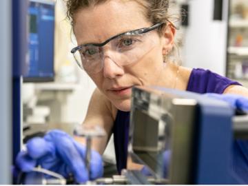 Elizabeth Herndon uses spectroscopic techniques at ORNL to analyze the chemical composition of leaves and other environmental samples to better understand the soil carbon cycle. Credit: Genevieve Martin/ORNL, U.S. Dept. of Energy