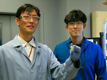 ORNL polymer scientists Tomonori Saito, left, and Sungjin Kim upcycled waste plastic to create a stronger, tougher, solvent-resistant material for new additive manufacturing applications. Credit: Genevieve Martin/ORNL, U.S. Dept. of Energy