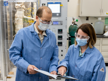 ORNL’s Bruce Pint, left, and Marie Romedenne review experiment results. Credit: ORNL, U.S. Dept. of Energy