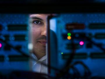 A team led by Raymond Borges Hink has developed a method using blockchain to protect communications between electronic devices in the electric grid, preventing cyberattacks and cascading blackouts. Credit: Genevieve Martin/ORNL, U.S. Dept. of Energy