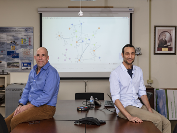 ORNL researchers led by Michael Garvin, left, and David Kainer discovered genetic mutations called structural variants and linked them to autism spectrum disorders, demonstrating an approach that could be used to develop better diagnostics and drug therapies. Credit: Carlos Jones/ORNL, U.S. Dept. of Energy