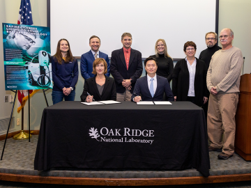 ORNL inventors and Safire Technology Group leadership attended a licensing event at the lab on Nov. 15. Standing, from left to right, are Katie Browning, Mike Grubbs, Gabriel Veith, Hayley Kleciak, Beth Armstrong, Sergiy Kalnaus and Kevin Cooley. Seated are Susan Hubbard and John Lee. Credit: Genevieve Martin/ORNL, U.S. Dept. of Energy