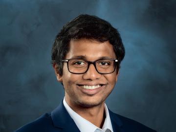 Studio portrait of a man wearing glasses