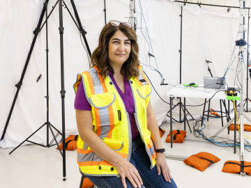 woman sitting in front of camera and sensing equipment