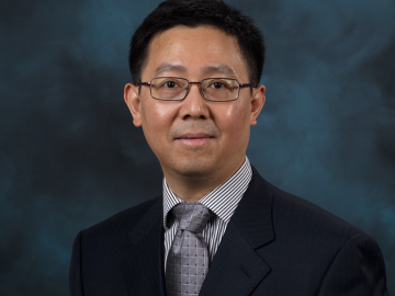 A man wearing a suit and tie