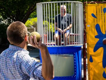 ORNL Chief Financial Officer Scott Branham manned the dunking booth for the Facilities & Operations Directorate’s ORNL Gives campaign. All ORNL directorates sponsored fundraisers in 2022. Credit: ORNL/Carlos Jones