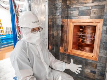 Vincente Guiseppe, co-spokesperson of the Majorana Collaboration and a research staff member at ORNL, in front of the Majorana Demonstrator shield on the 4850 Level of SURF. Credit: Nick Hubbard/Sanford Underground Research Facility