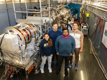 From left are UWindsor students Isabelle Dib, Dominik Dziura, Stuart Castillo and Maksymilian Dziura at ORNL’s Neutron Spin Echo spectrometer. Their work advances studies on a natural cancer treatment. Credit: Genevieve Martin/ORNL, U.S. Dept. of Energy