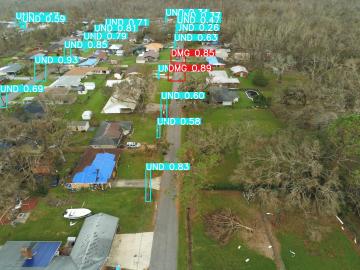 Aerial view of hurricane damage, with computer-generated utility pole detection.