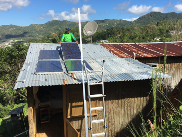 Through the Honnold Foundation and Casa Pueblo, solar panels are installed in Adjuntas, Puerto Rico, and hooked to microgrids with battery storage. ORNL researchers are developing a microgrid orchestrator to manage the microgrids together for increased long-term electrical reliability. Credit: Fabio Andrade