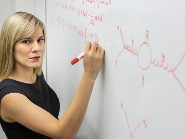 Andrea Delgado, Distinguished Staff Fellow at Oak Ridge National Laboratory, uses quantum computing to help elucidate the fundamental particles of the universe. Credit: Carlos Jones/ORNL, U.S. Dept. of Energy